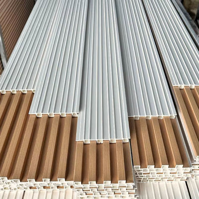 পাইকারি মূল্য আধুনিক নকশা WPC ওয়াল বোর্ড অ্যান্টি স্ট্যাটিক অভ্যন্তরীণ কাঠের স্লট ওয়াল প্যানেল ইনডোর ওয়াটারপ্রুফ WPC ওয়াল আবরণ জন্য